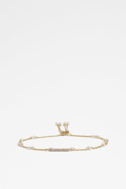 ALDO gold-tone bracelet with dangling crown charm and crystal accents, adjustable chain
