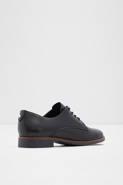 Black lace-up oxford shoe, front-quarter view with pull-tab