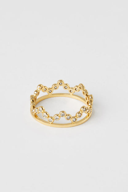 Gold-tone ring with scalloped top and clear rhinestone line across center