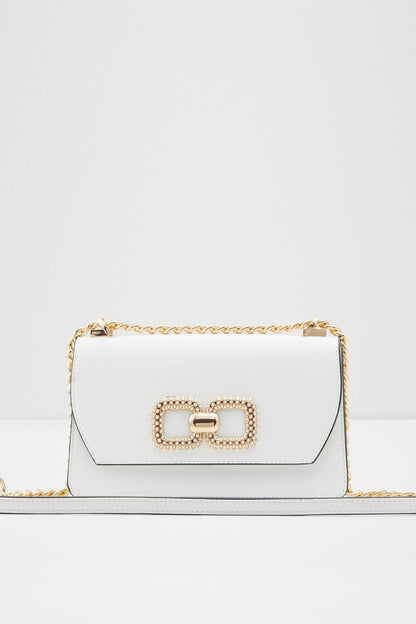 White handbag with gold chain strap and front buckle clasp detail