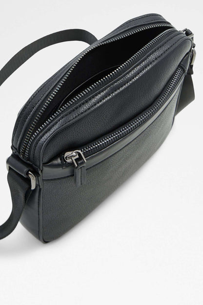 ALDO black leather crossbody bag close-up with double zippers and metal hardware