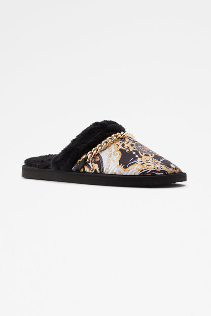 Black faux-fur slide mule with patterned upper and gold chain detail at vamp