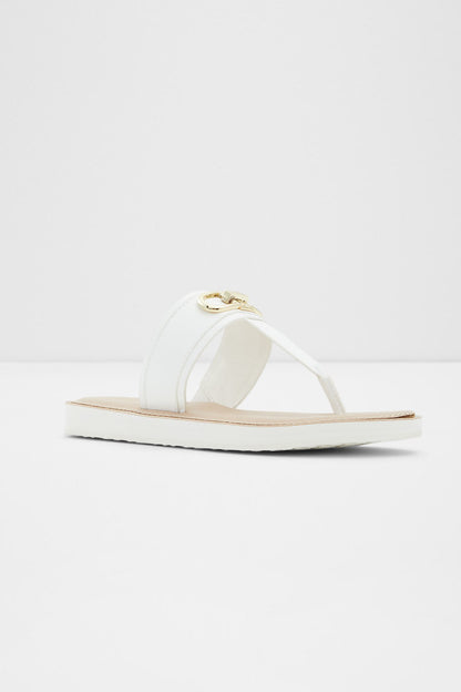ALDO white slide sandals with curved strap and gold buckle ornament