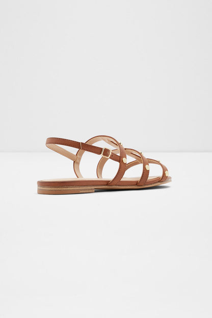 Cognac flat sandals with strappy design and gold-tone buckle hardware
