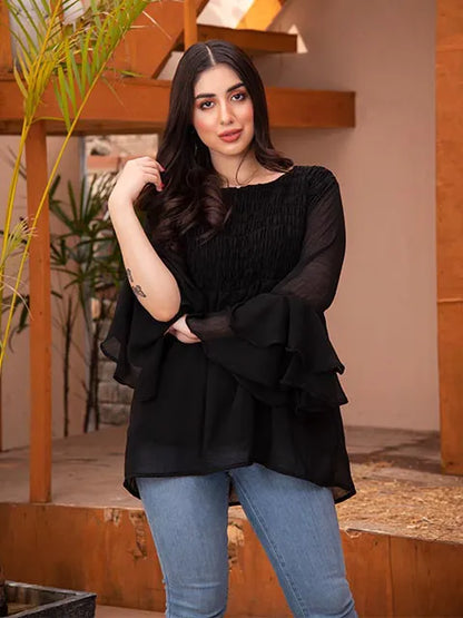 Black ruffle tunic blouse with flowing bell sleeves and tiered waist hem