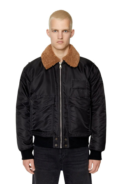 Men's black bomber jacket with tan shearling-style collar and zip front
