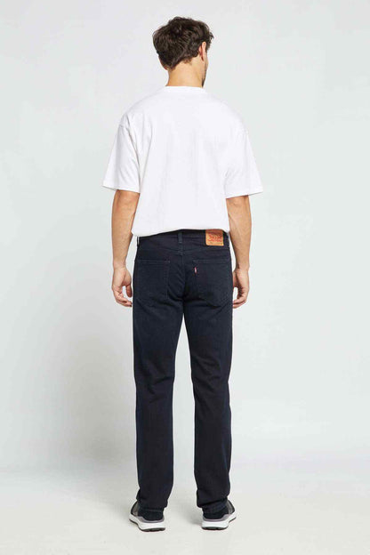 Men's black denim jeans, back view with straight legs