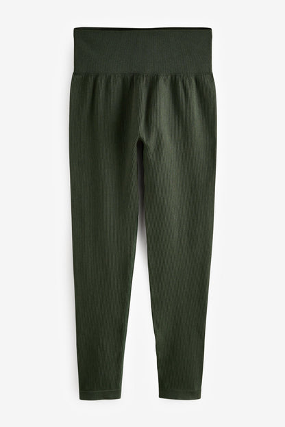 Forest green ribbed leggings laid flat, high waist and ankle-length