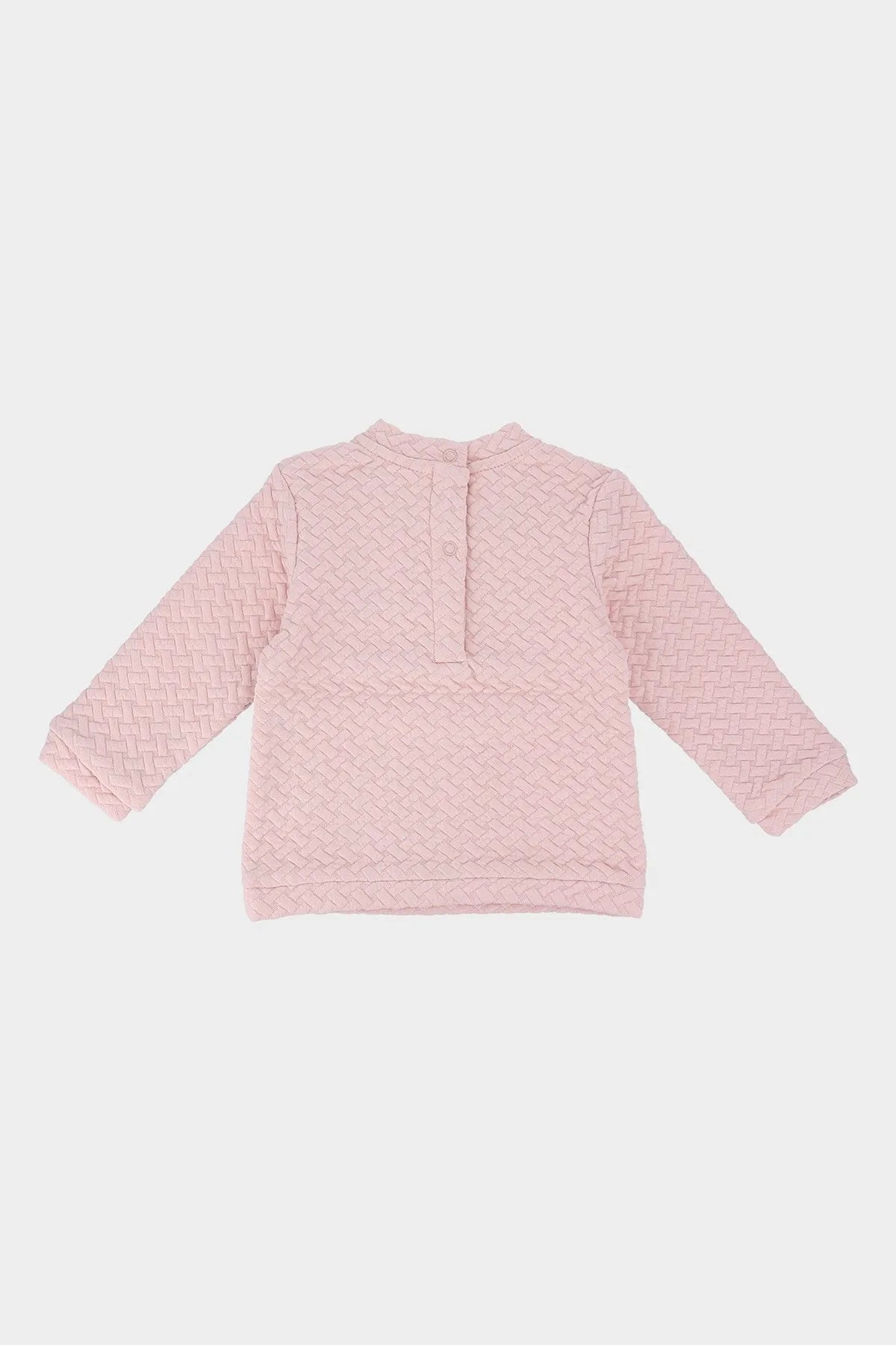 Pink textured long-sleeve baby top, back view, buttoned neckline
