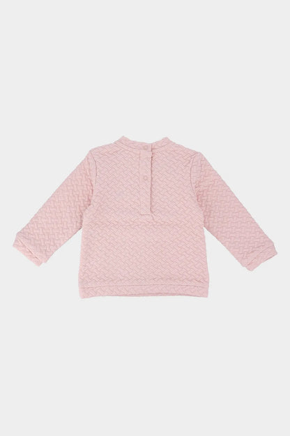 Pink textured long-sleeve baby top, back view, buttoned neckline