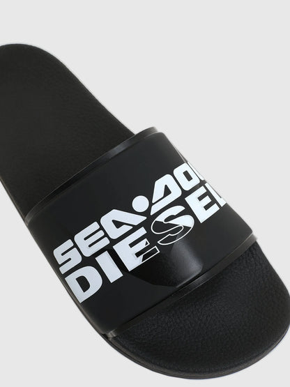 Diesel black slide sandals close-up of logo strap