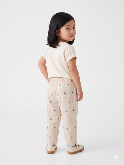 Cream kids' pants with teal and pink cactus print, elastic waistband, cuffed ankles