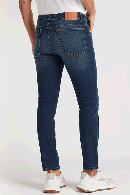 Men's blue denim jeans with back yoke and stitched rear pockets
