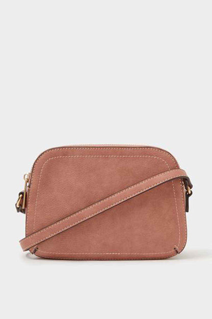Dusty pink mini crossbody bag with zip closure and adjustable strap