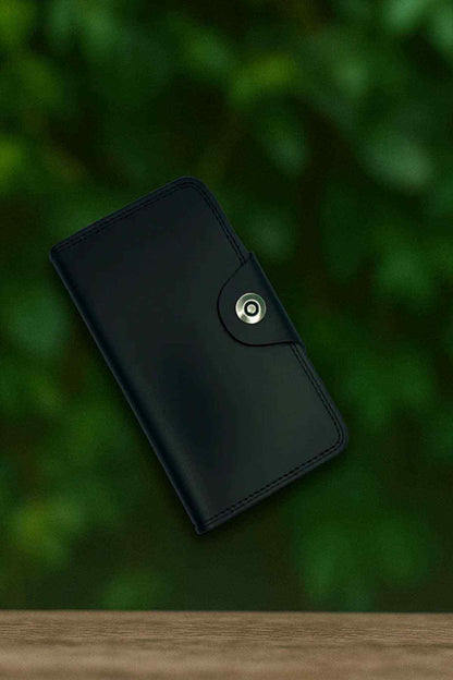 Dark leather bifold wallet with snap button closure