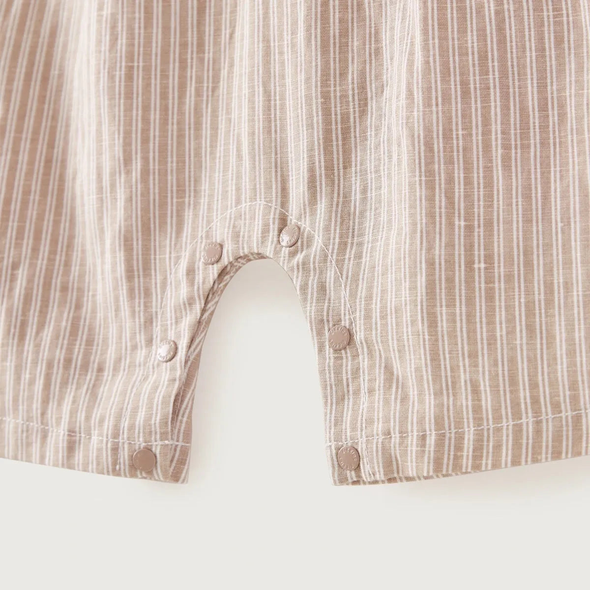 Beige striped baby shorts front with snap buttons