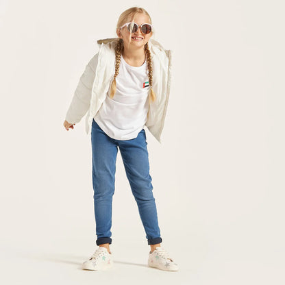 Blue denim baby jeans with cuffed hems and front pockets
