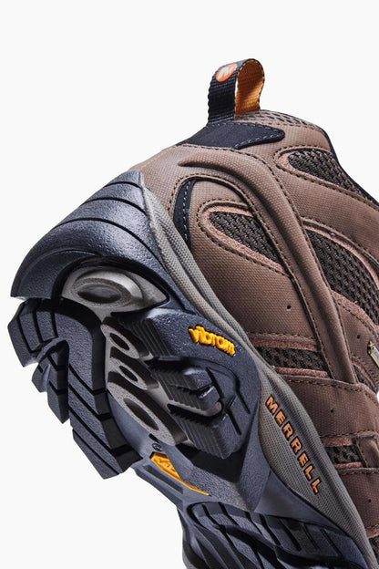 Merrell hiking boot outsole and toe detail, brown upper with dark tread sole.