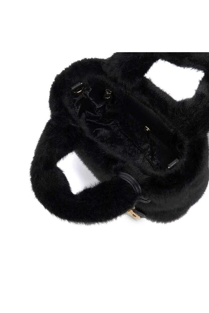 Black faux-fur mini tote showing interior with zip pocket and strap hardware