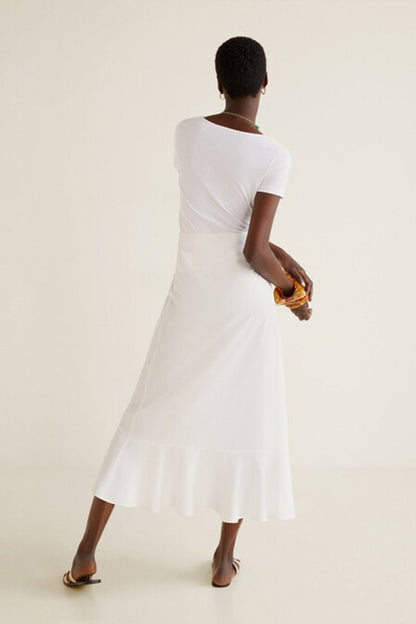 Off-white midi dress back view with short sleeves and tiered A-line skirt hem