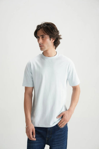 Light blue crew-neck short-sleeve T-shirt on model, front view with relaxed fit