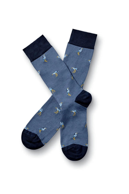 Charles Tyrwhitt blue socks with yellow dinosaur print and navy toe cuff