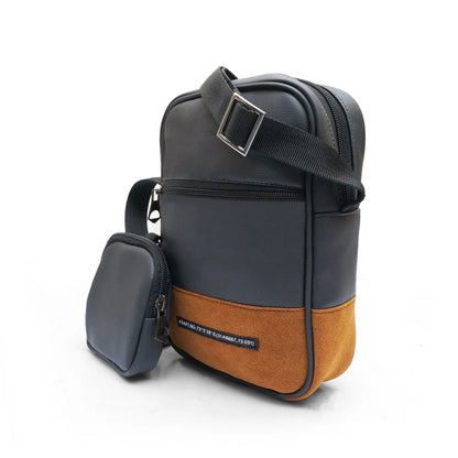 Black and tan crossbody bag with strap buckle, zip front pocket, and mini pouch