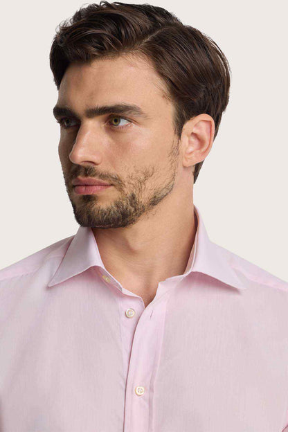 Pink dress shirt with pointed collar and buttoned front placket