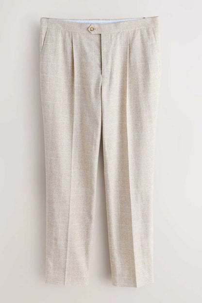 Light beige suit trousers flat lay, front view with buttoned waistband