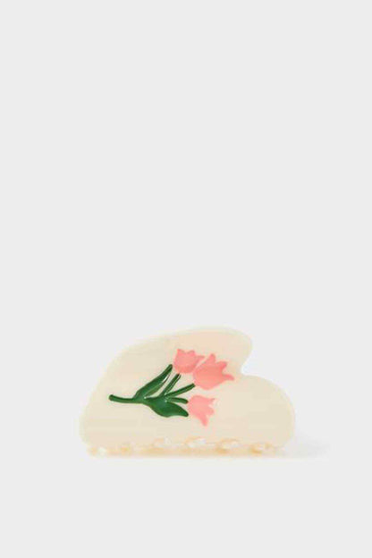 Cream slide sandals with pink flower applique and green leaf detail