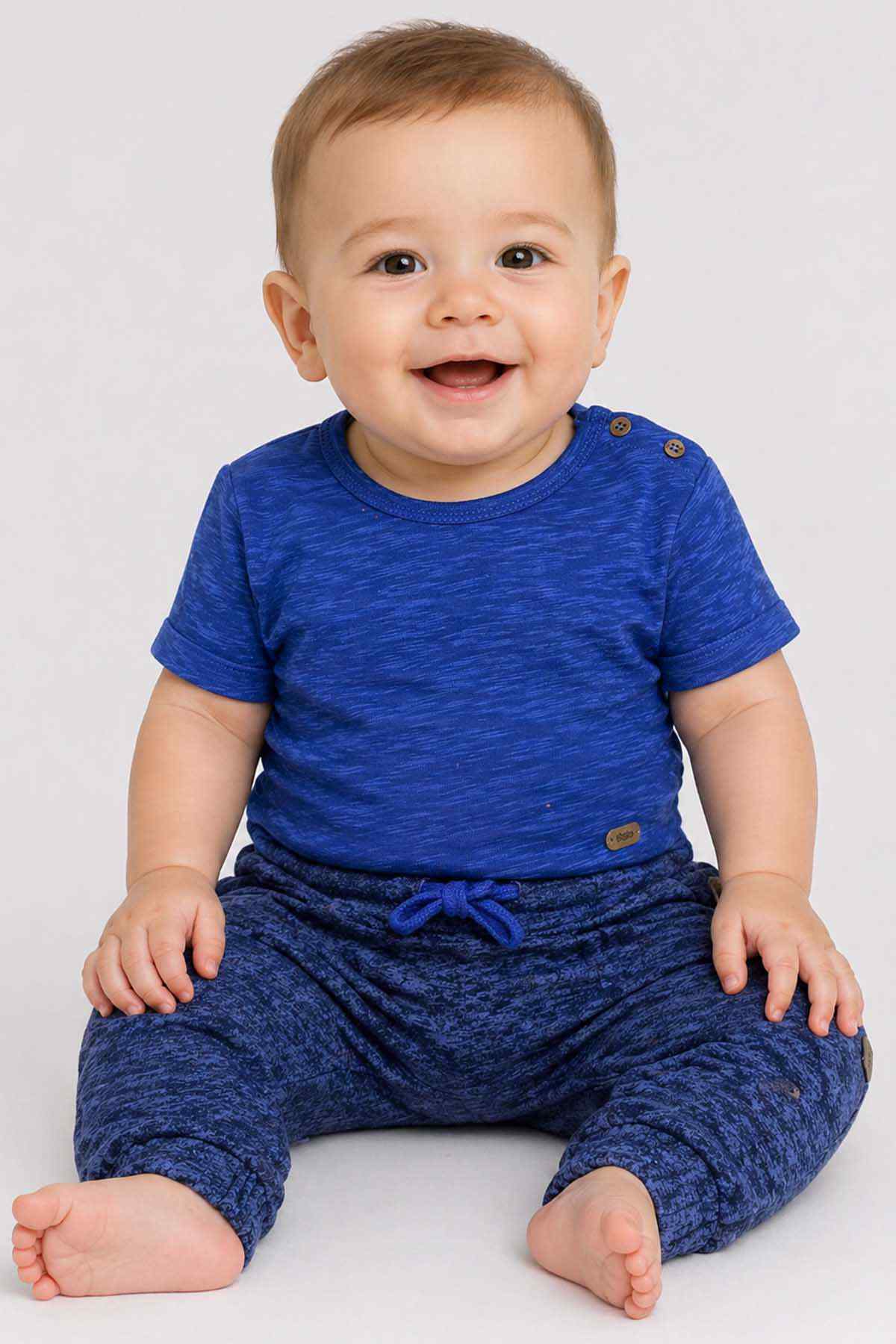 Blue baby T-shirt and jogger set, seated view with bow drawstring waist