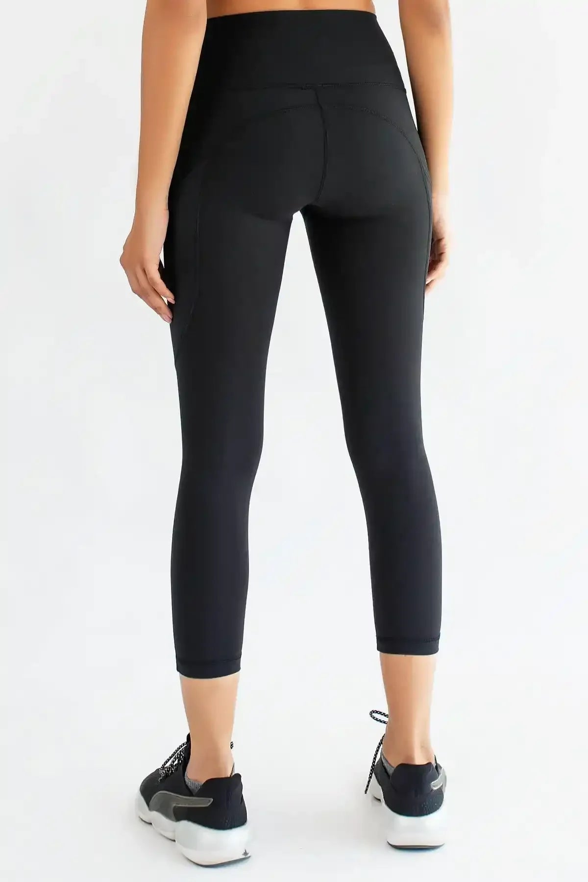 Black capri leggings, back view, smooth stretch fabric and cropped hem