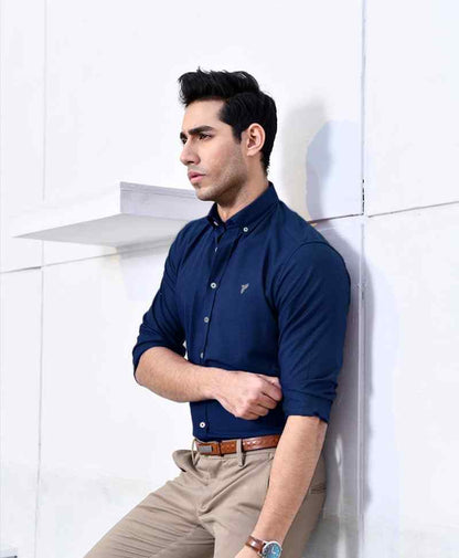 Blue fitted button-up shirt with collar and button placket, side view