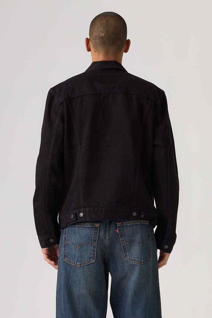 Black denim jacket back view with button closure and flap pockets