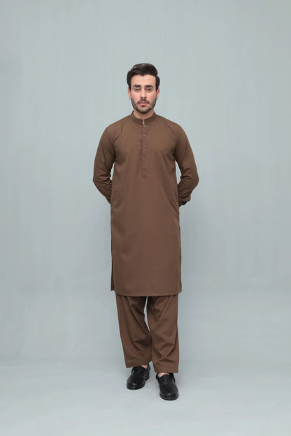 Men's brown long kurta with matching shalwar, full-body standing front