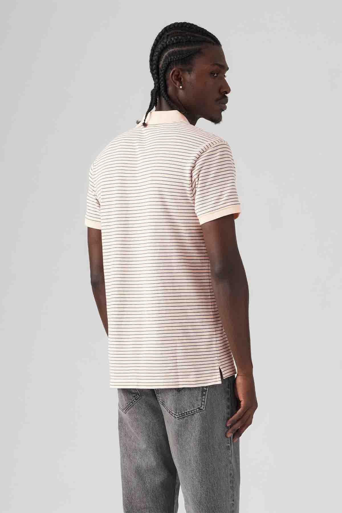 Levi's pink-and-white striped polo shirt, short sleeves, side/rear view