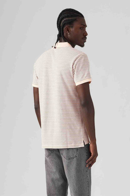 Levi's pink-and-white striped polo shirt, short sleeves, side/rear view