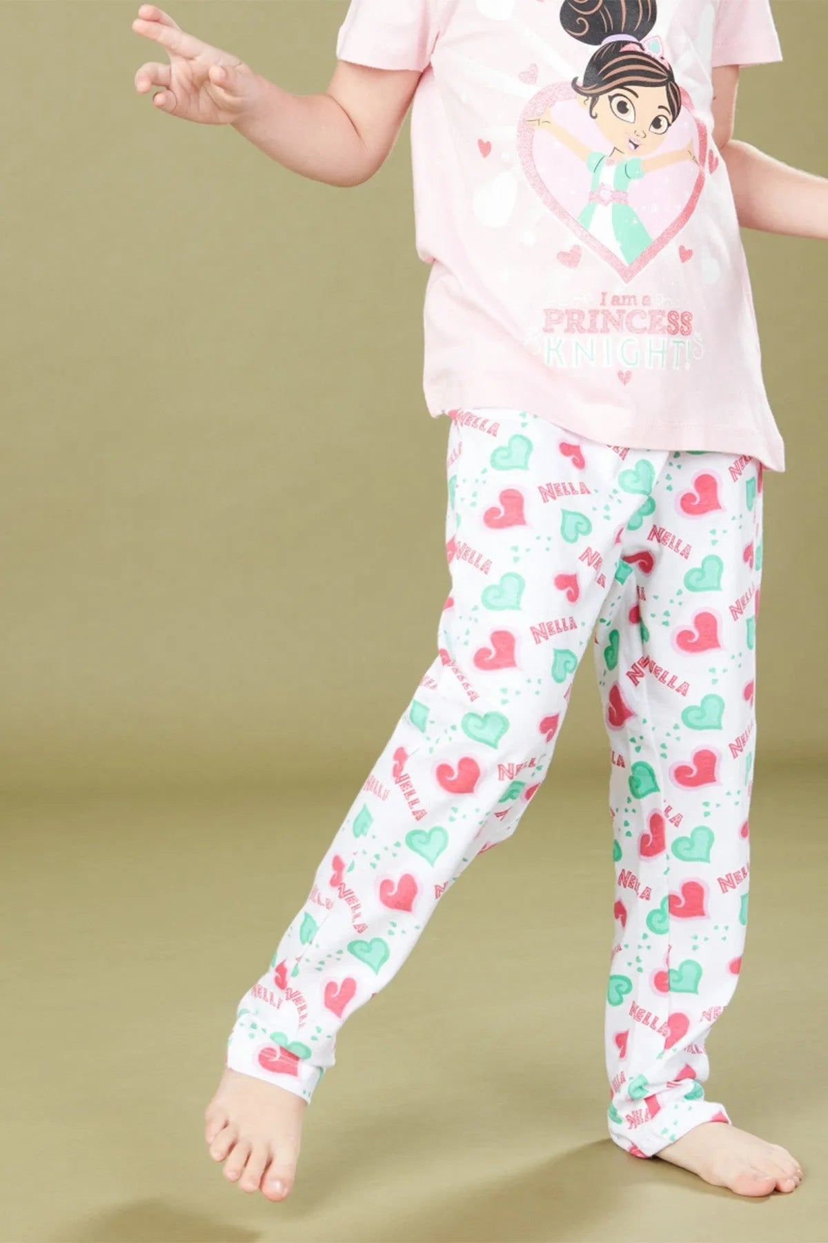 Pink princess graphic tee and heart pattern pajama pants, ankle-length