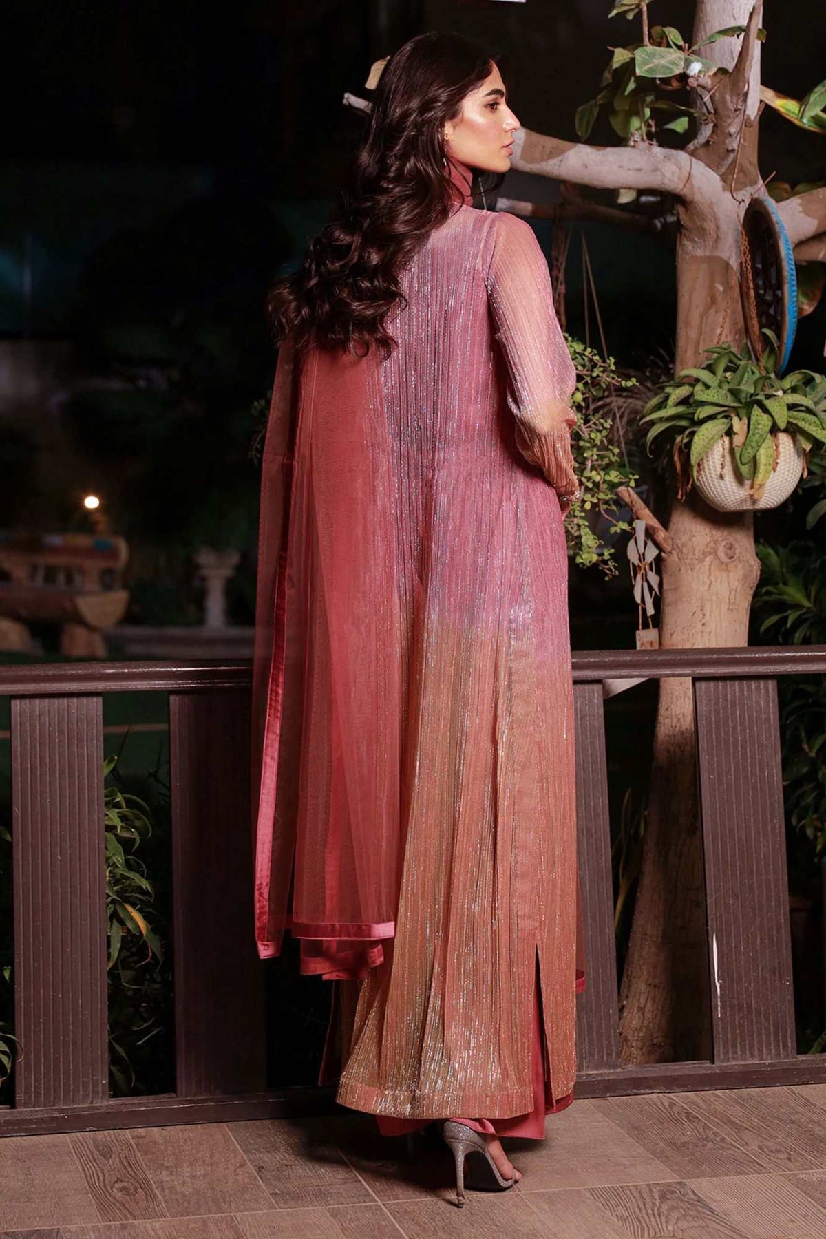 Velour rose pink long dress, three-quarter side view with flowing skirt and dupatta