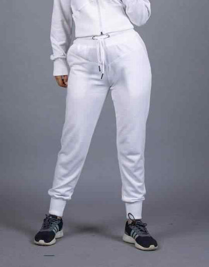 White joggers with drawstring waist and ribbed cuffs, paired with zip hoodie.