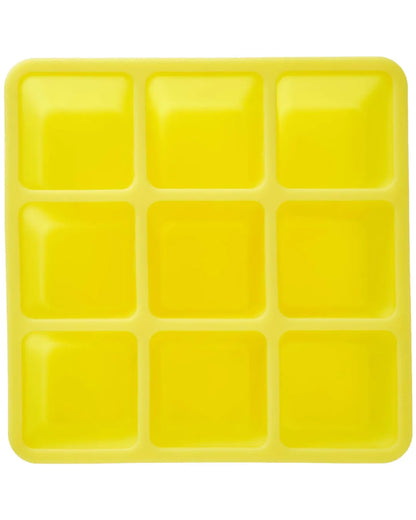 Yellow ice cube tray with 12 square compartments, front view