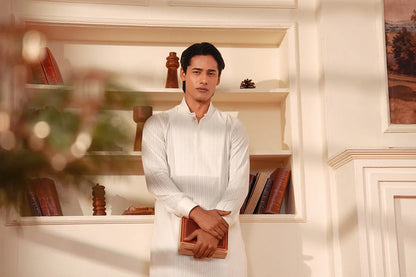 Men's white kurta and pants set, front view with arms crossed at waist