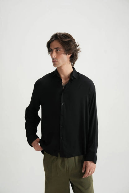 Black button-up long-sleeve shirt, front view with button placket and collar.