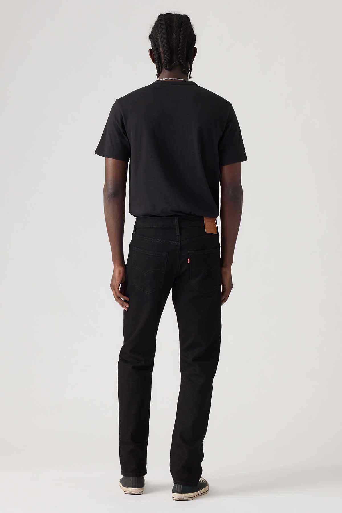 Black denim jeans, back view with five-pocket design and rear yoke
