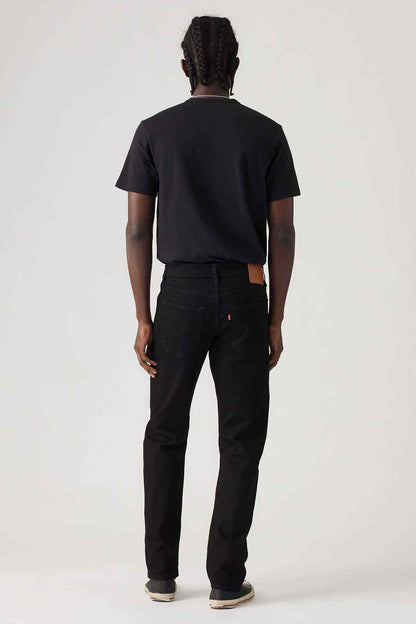 Black denim jeans, back view with five-pocket design and rear yoke