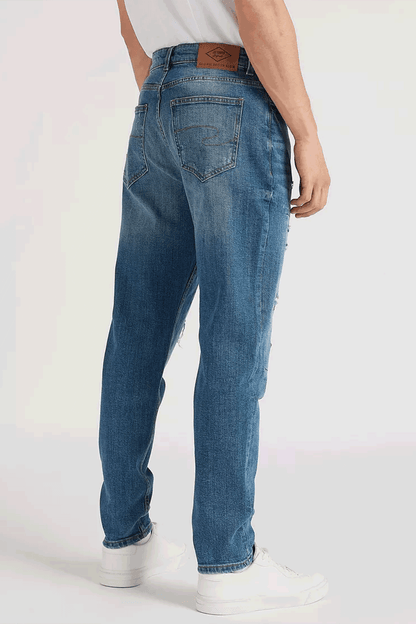 Men's blue denim jeans, back view with belt loops, rear pockets, worn whiskering