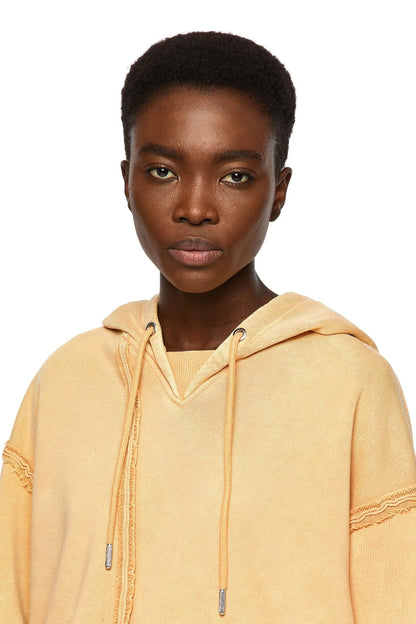 Orange hoodie close-up with drawstring hood and stitched front pocket
