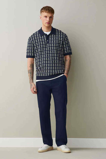 Navy straight-leg trousers with relaxed fit, belt loops and button fly