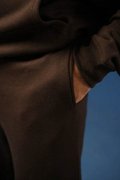 Brown pant fabric close-up with ribbed knit hem cuff