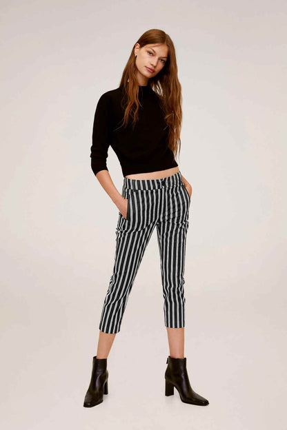 Black cropped knit sweater with vertical stripe capri pants, long sleeves